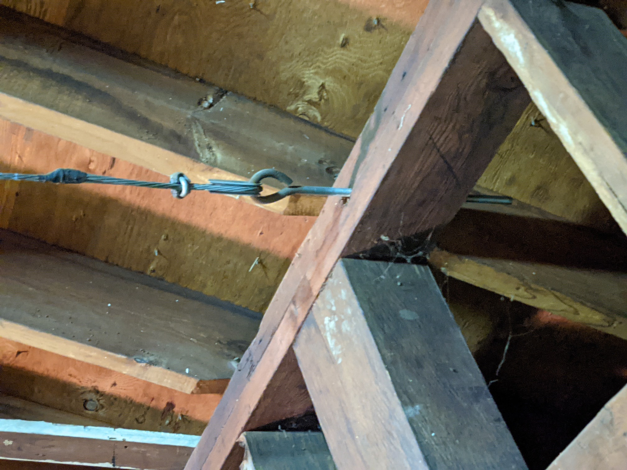 structural engineering Tension cable underneath rafter tie
