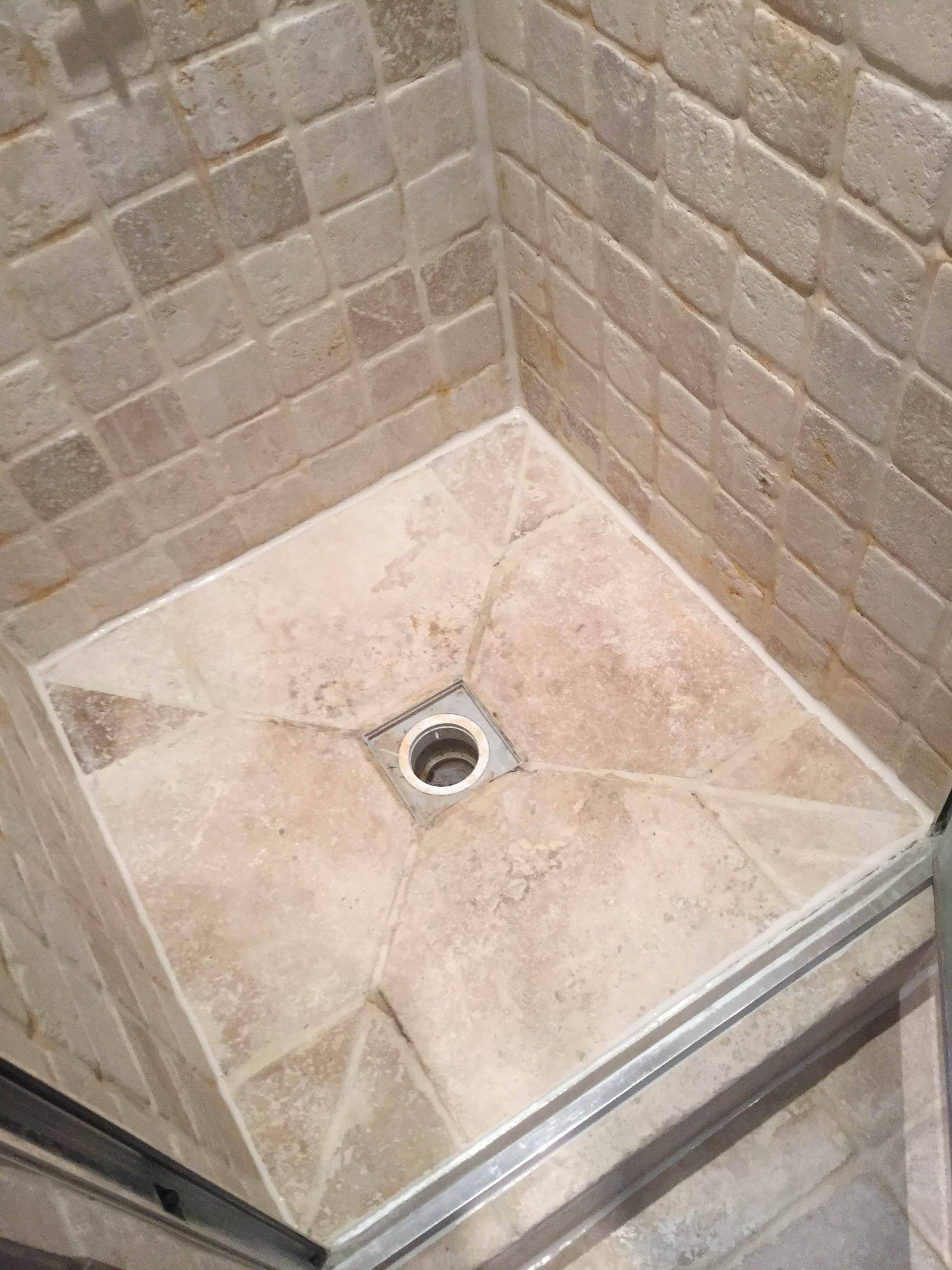 shower How can I repair cracked stones around a drain in a wet room