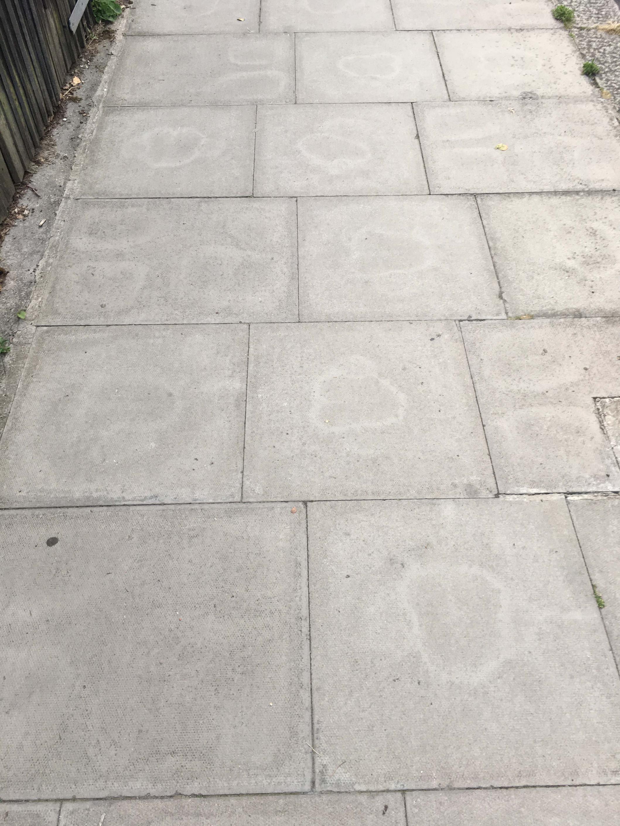 geometry Why did staining marks on these paving slabs form geometric