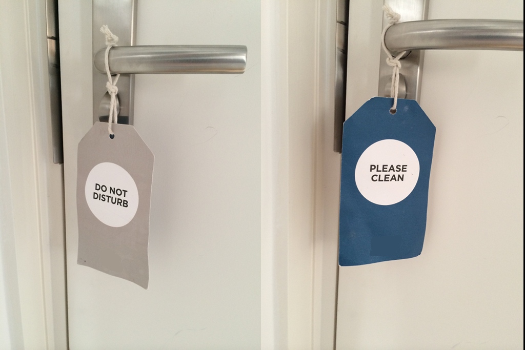 physical "Do Not Disturb" tags in hotels, how can they be improved