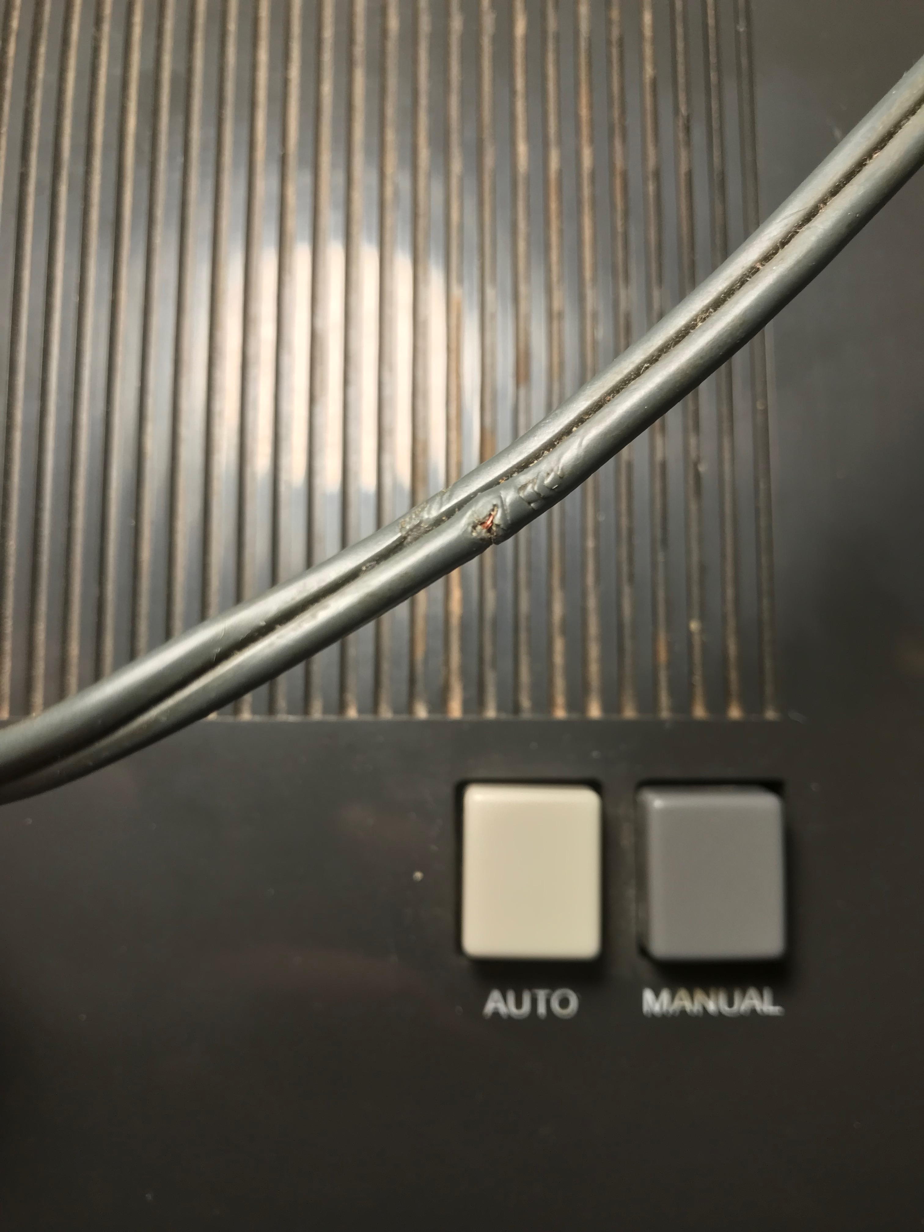 Small nick on power cord from an electric alarm clock, and copper