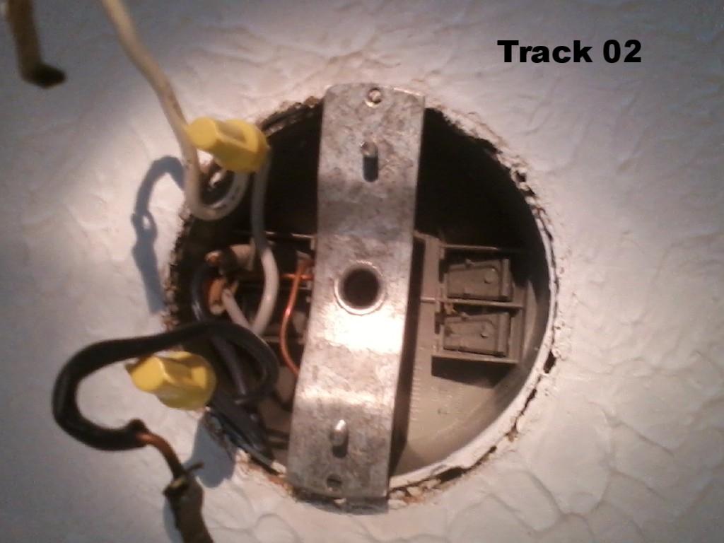 how do I remove this old track light hanger from junction box? Home