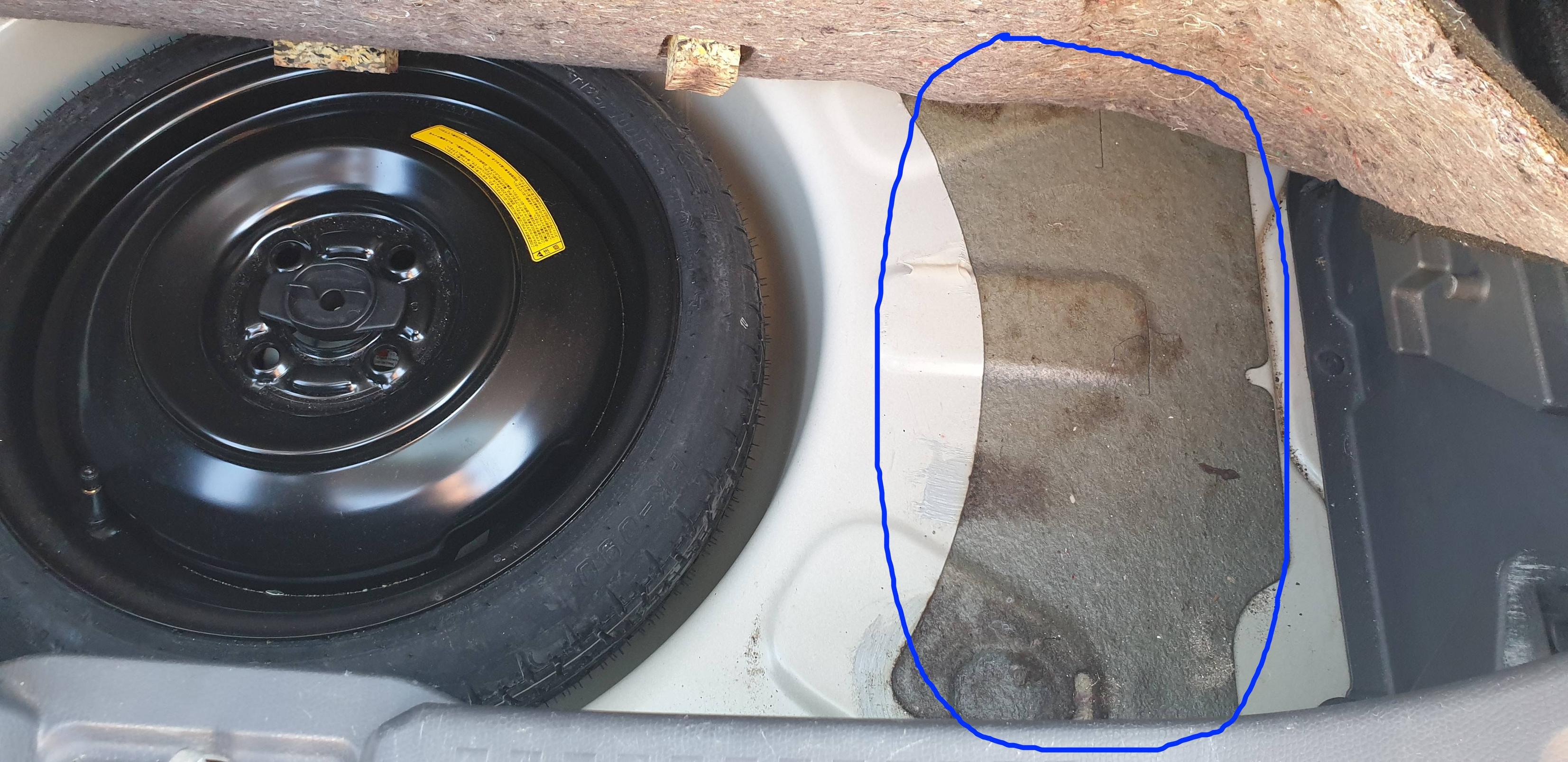 suzuki What is this sticky surface underneath the trunk carpet