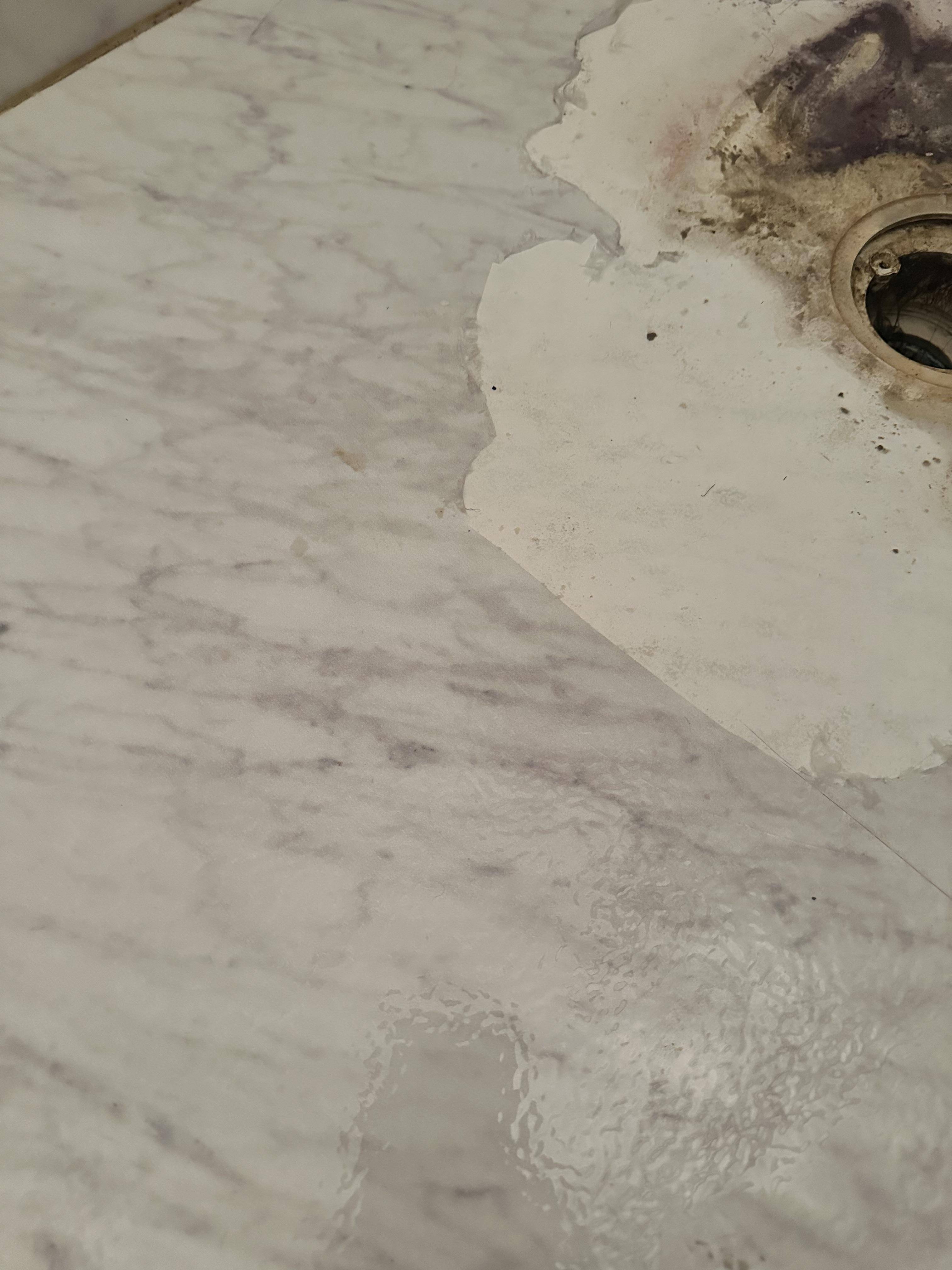 How do I fix a peeling shower floor? Home Improvement Stack Exchange