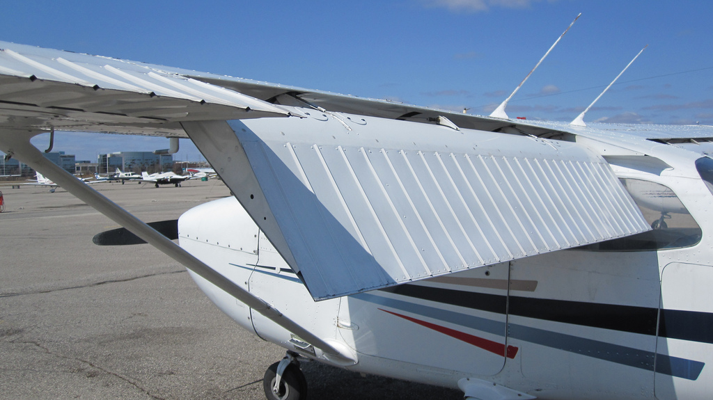 aerodynamics Why does stall speed decrease when flaps are deployed