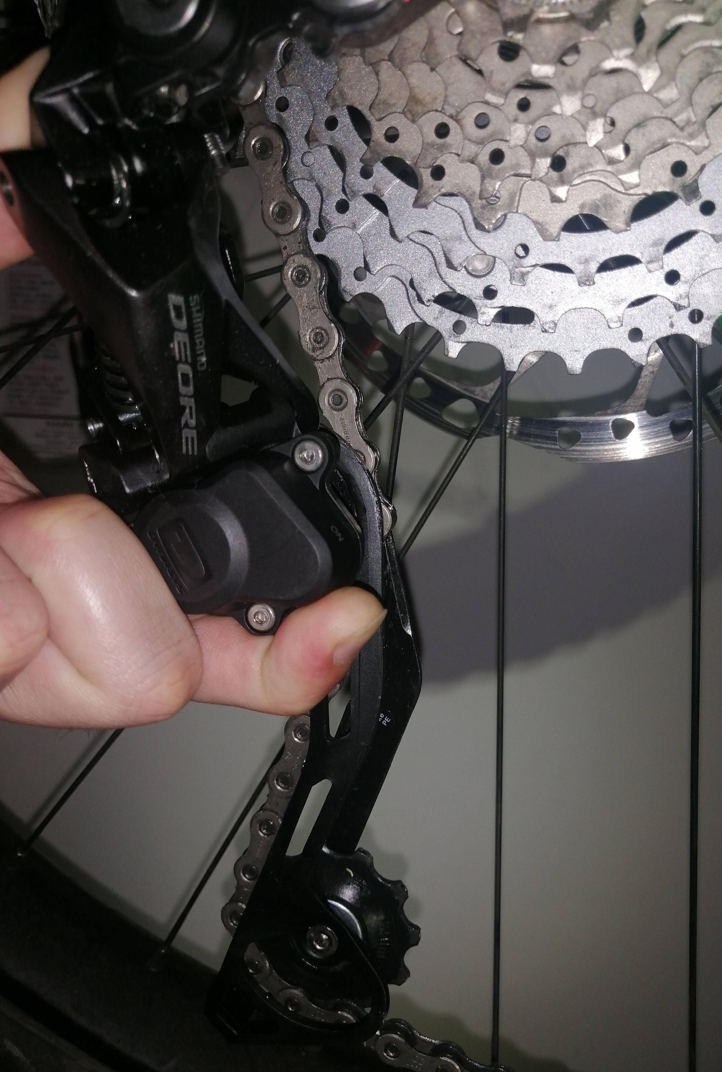 mountain bike Can I reorient my dérailleur so the top jockey doesn't hit the cassette