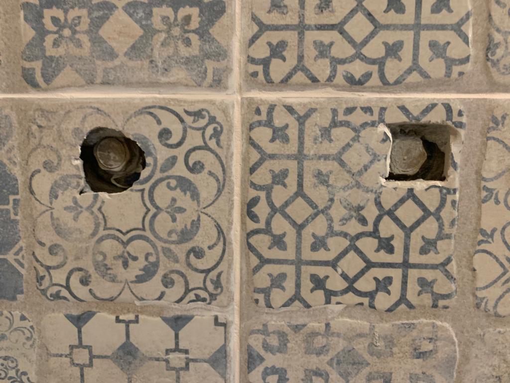 concrete How to safely chip away at a tile to make room Home