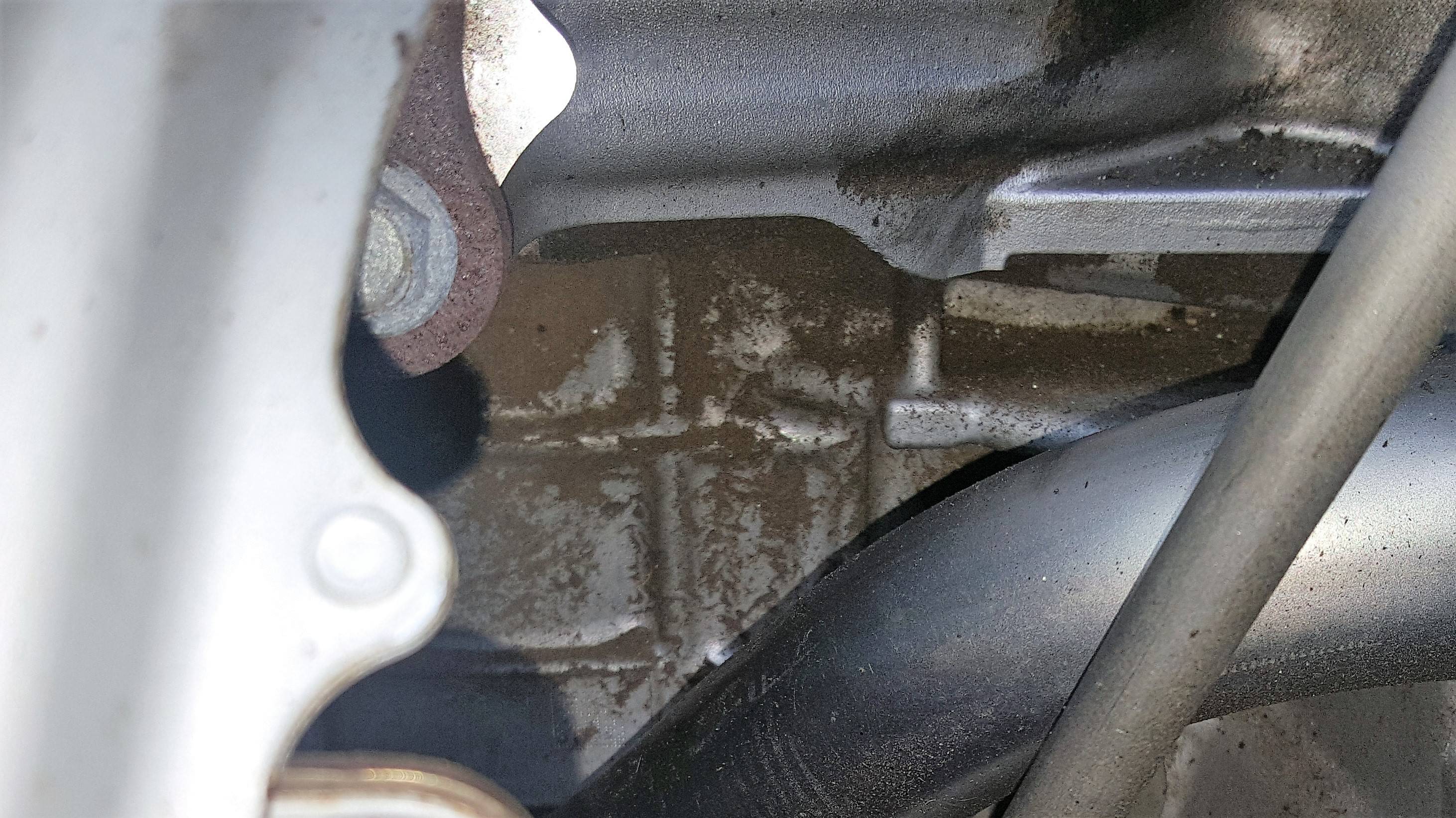 sparkplugs Sand like residue inside my engine bay area. Could it have
