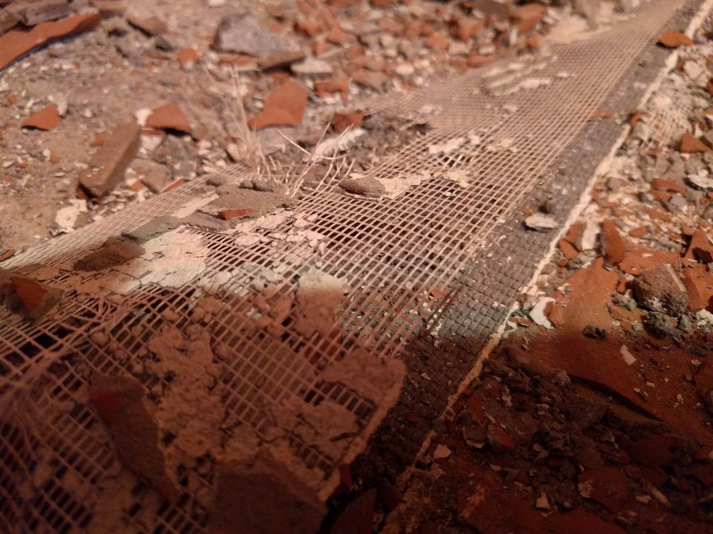 Bathroom Tile Removal Underlayment and membrane coming up Home