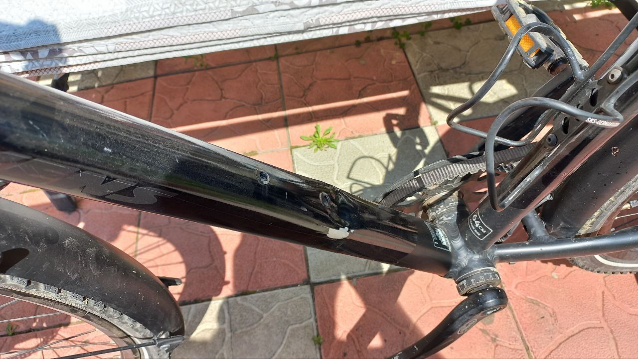 Is it possible to repair a dent on an aluminum frame using carbon fiber