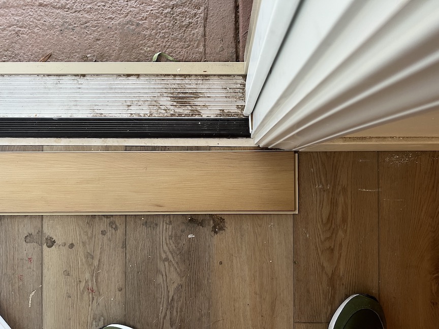 flooring Vinyl plank installation near exterior doorway Home