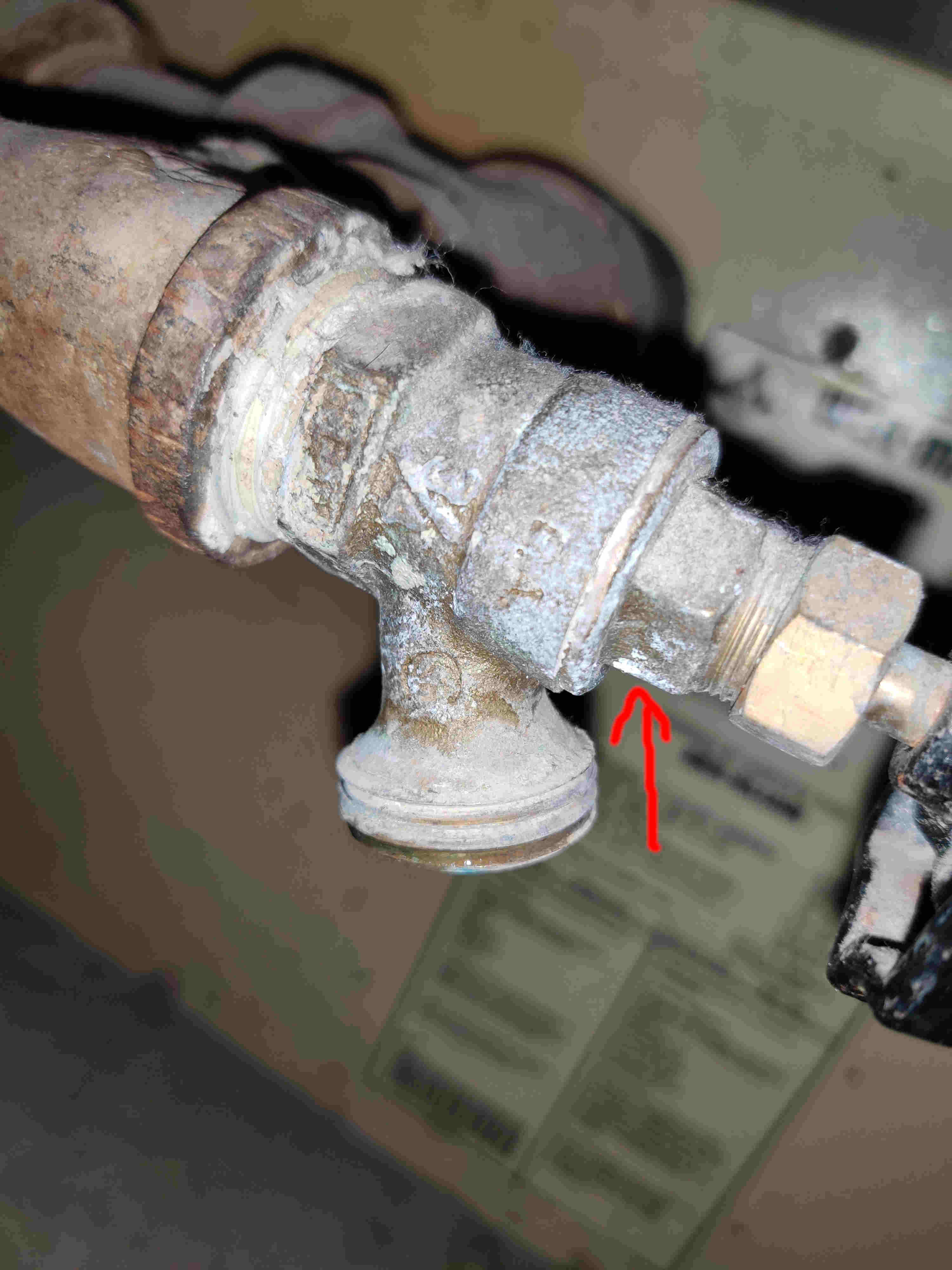 Should I use an impact wrench to loosen a plumbing nut on a boiler