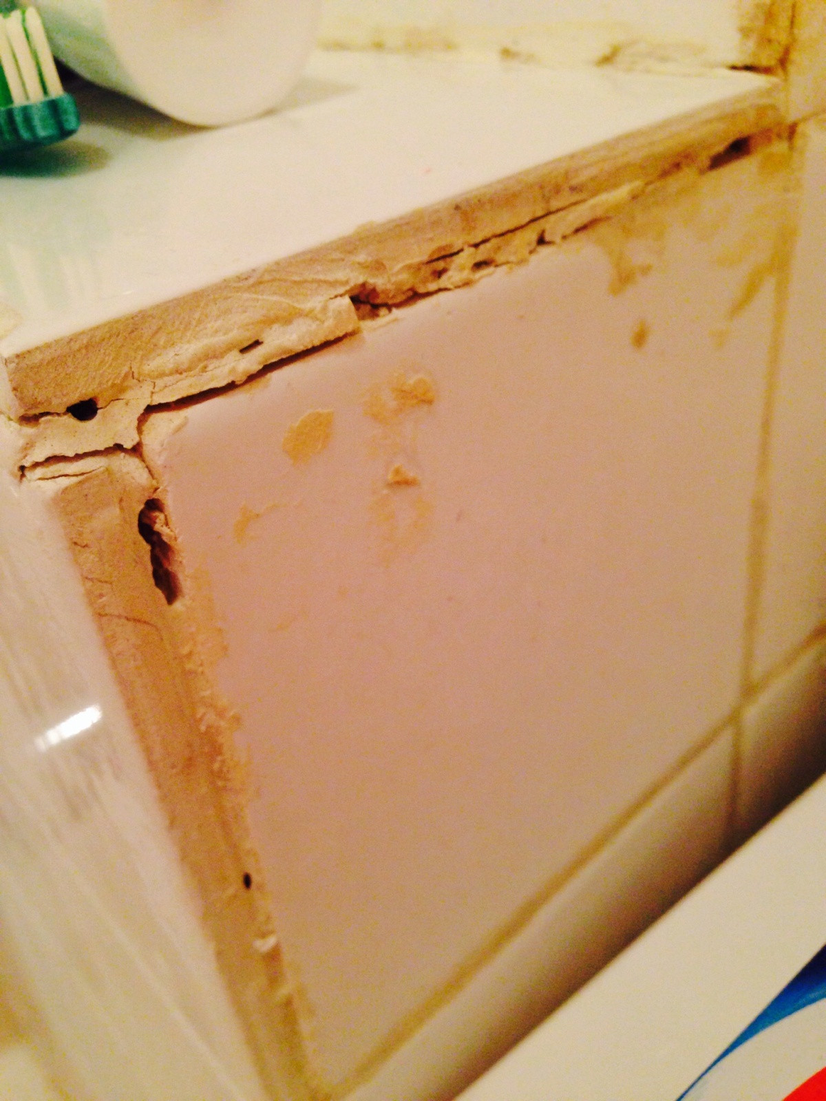 repair Can I regrout if there is possibility of mold/mildew behind