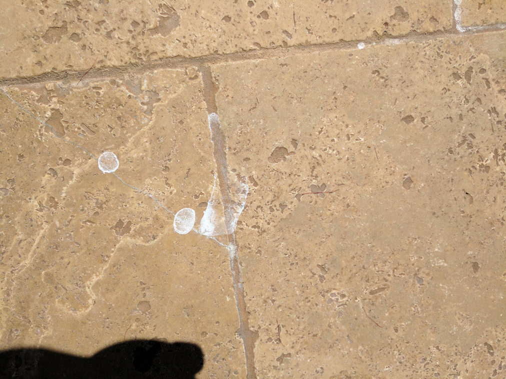 tile Cloudy white film spots on surface of stone sealer Home