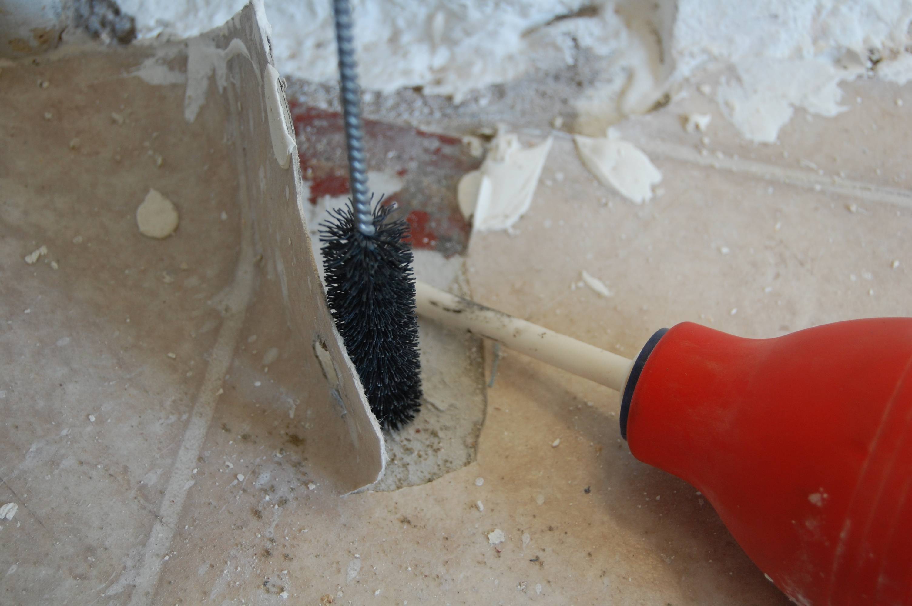 concrete How can I stop mortar plugs from popping out of slab holes