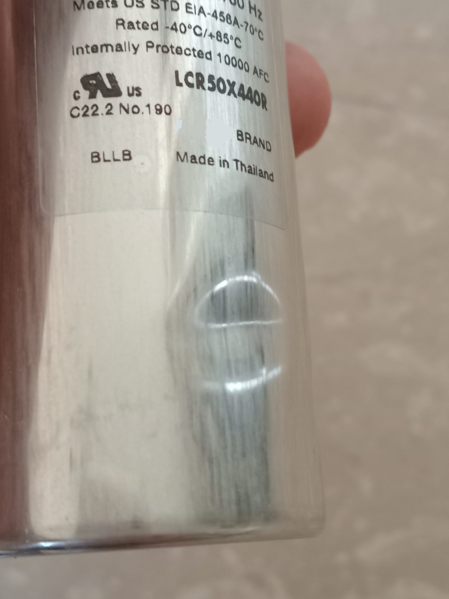 What are the symptoms of a dent on a run capacitor metal shell