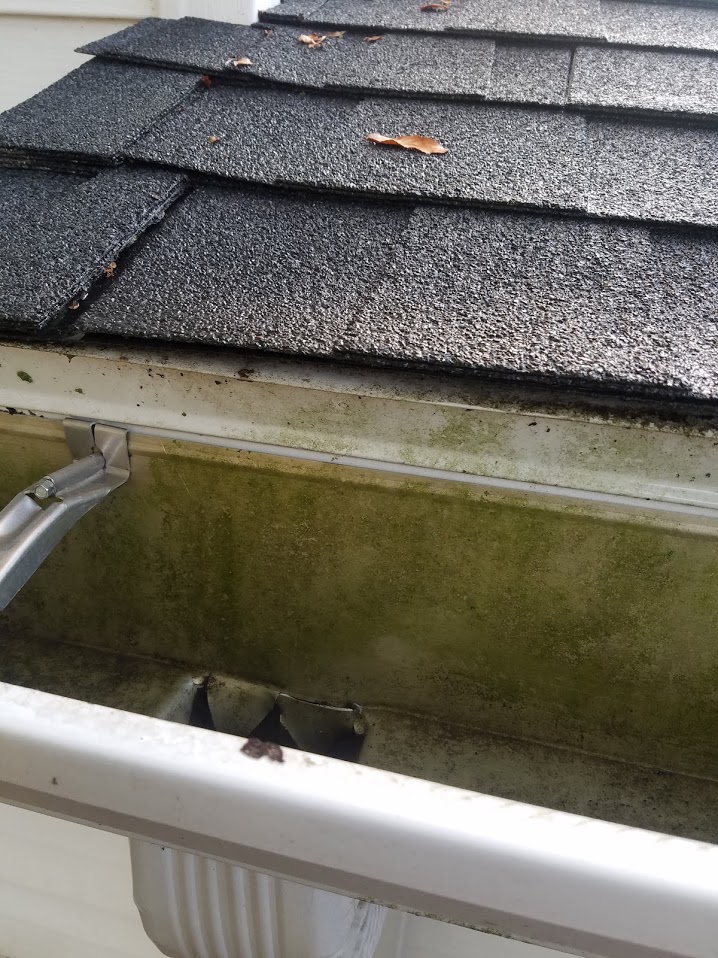 roof How can I prevent water from running behind my gutters and under