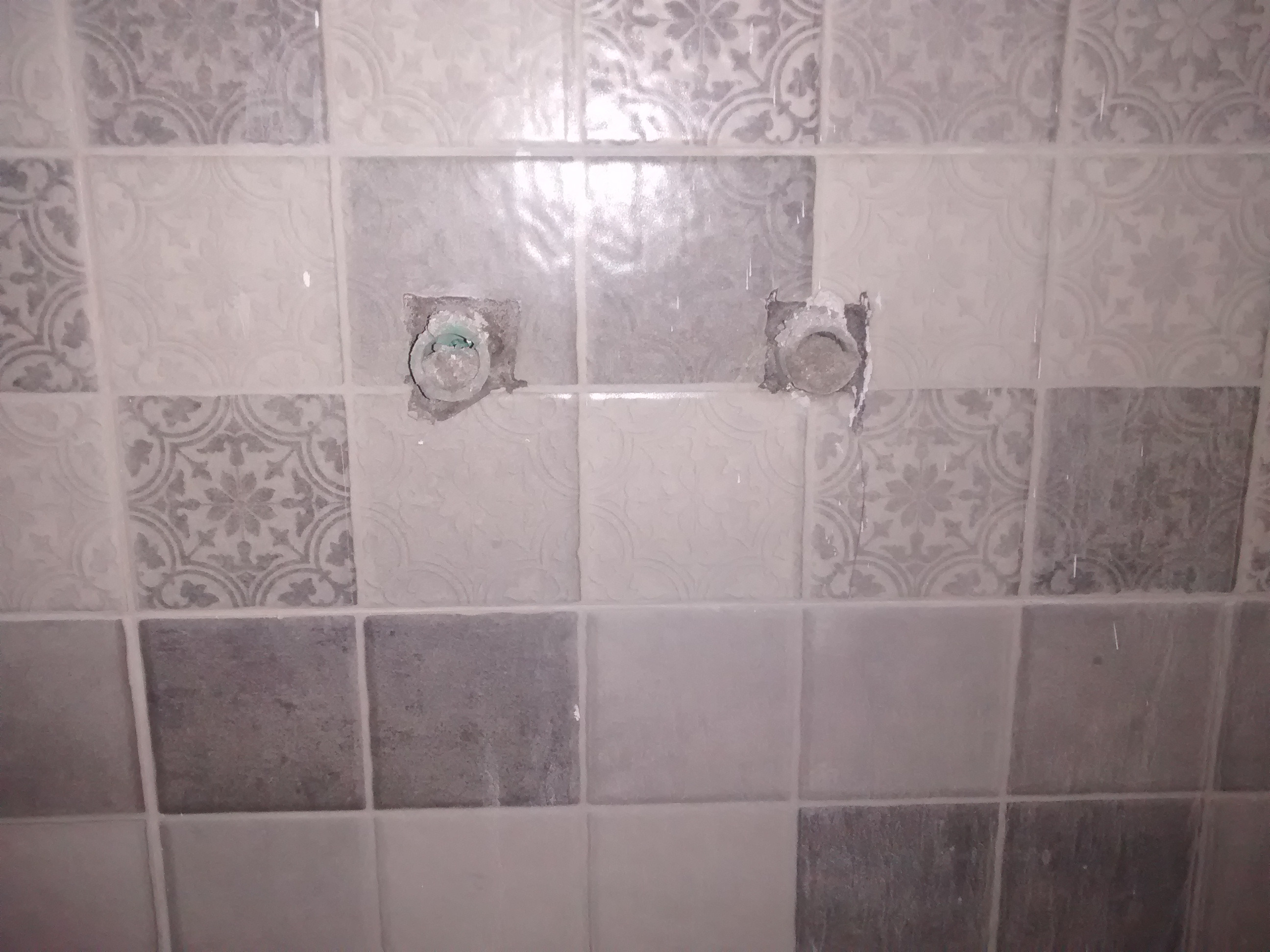 Should I replace this cracked bathroom wall tile? Home Improvement