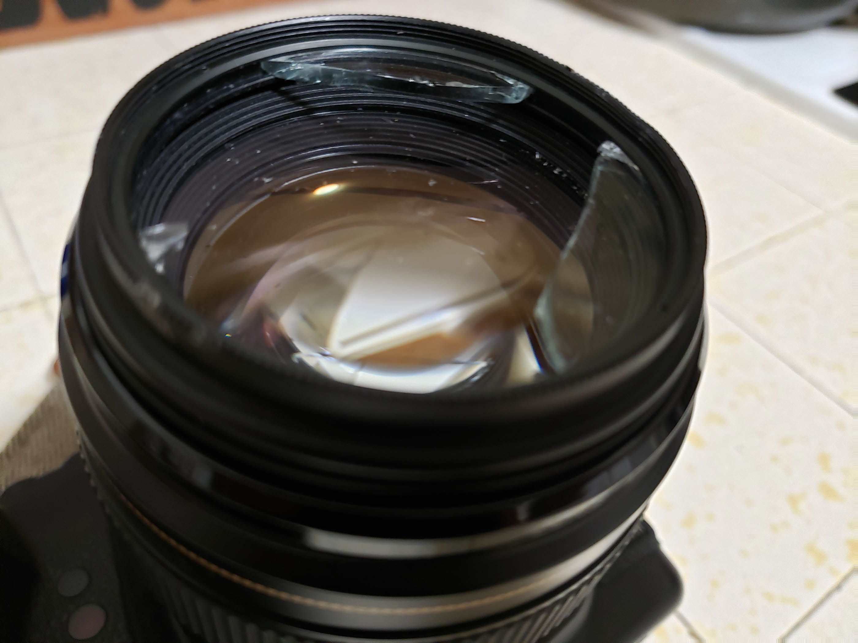 canon Can the front glass on a broken lens be repaired? Photography