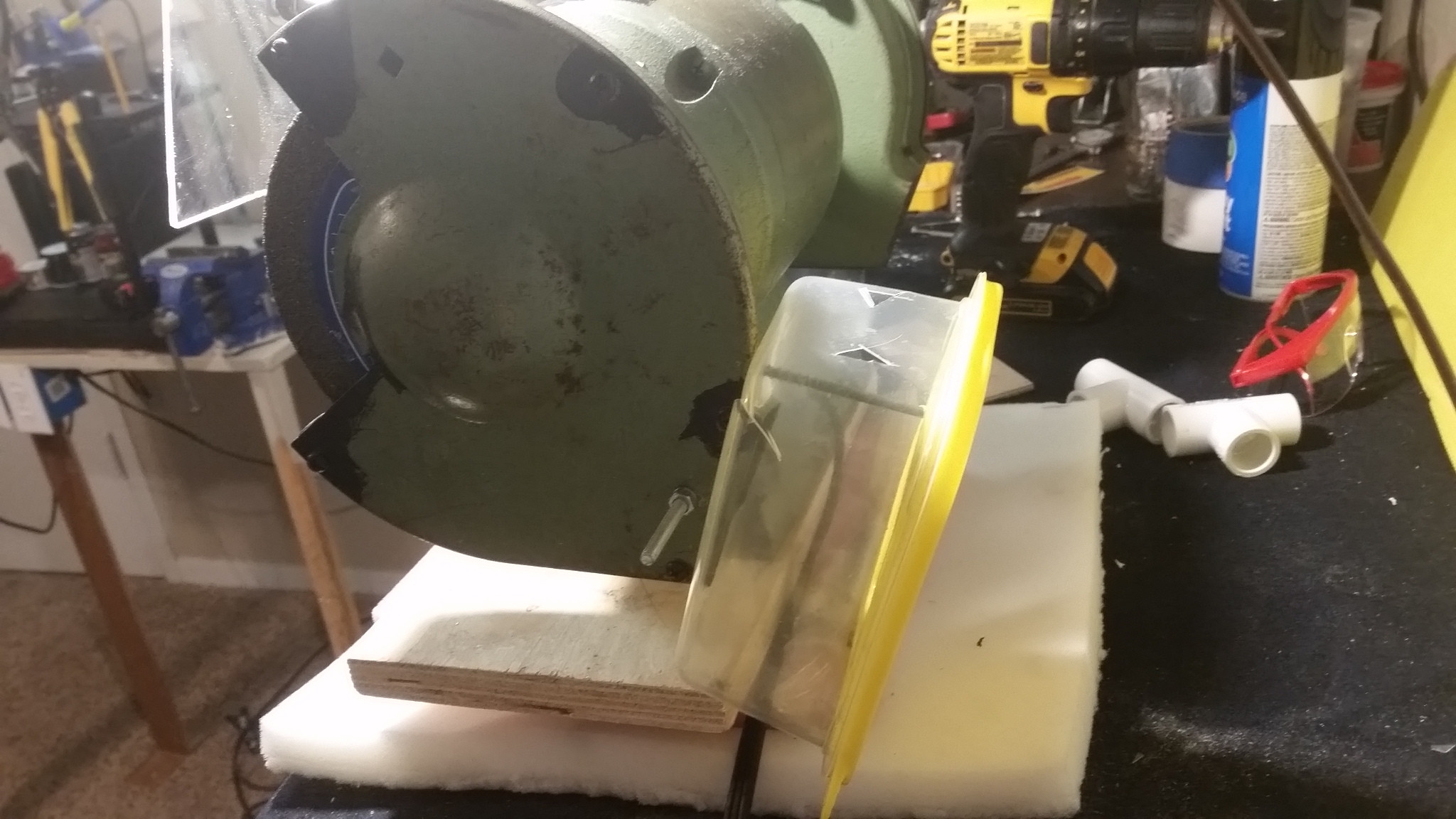 Something to catch exhaust particles made by bench grinder Home