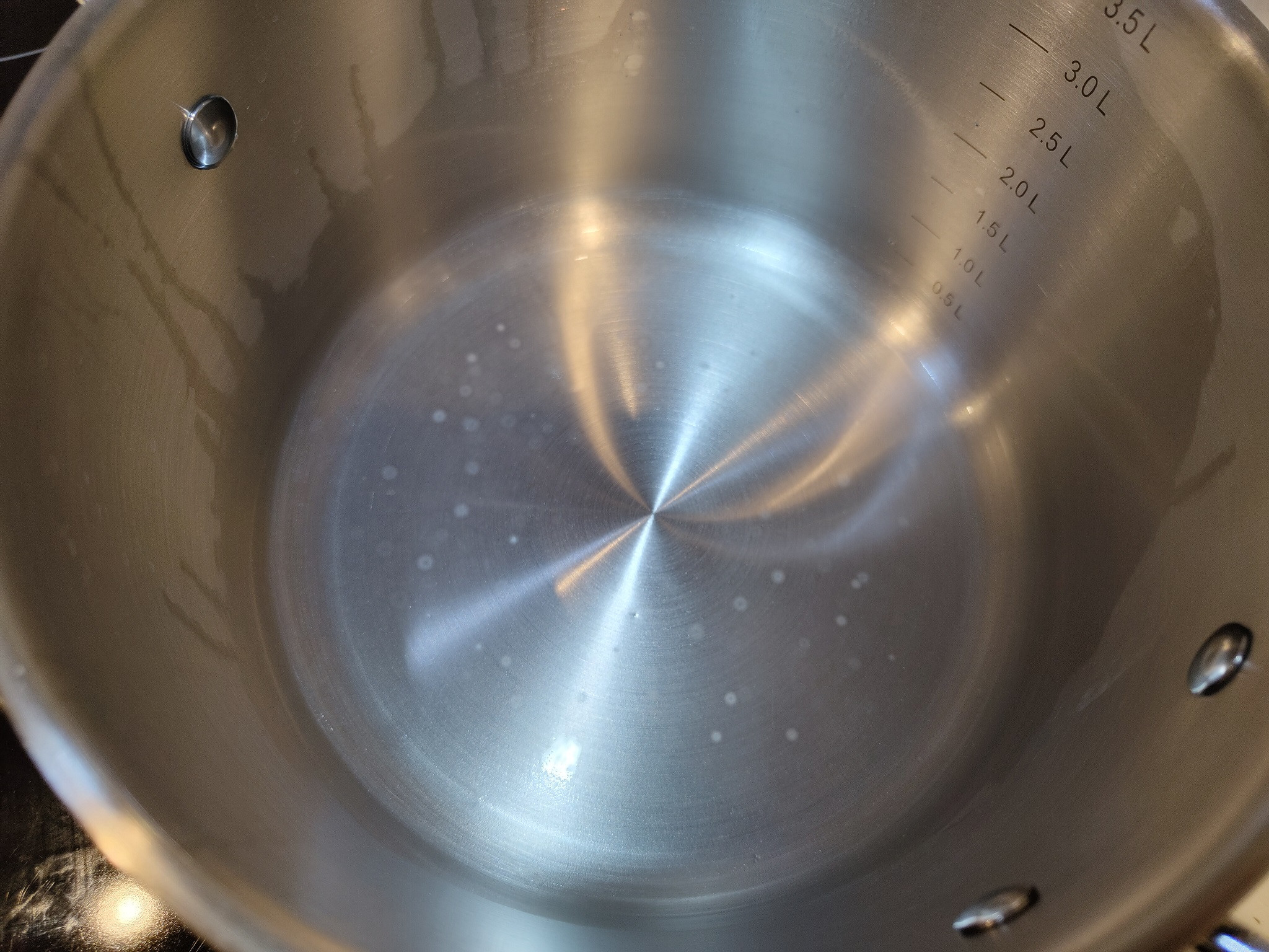 food safety Are these mold spots on my new stainless steel pans