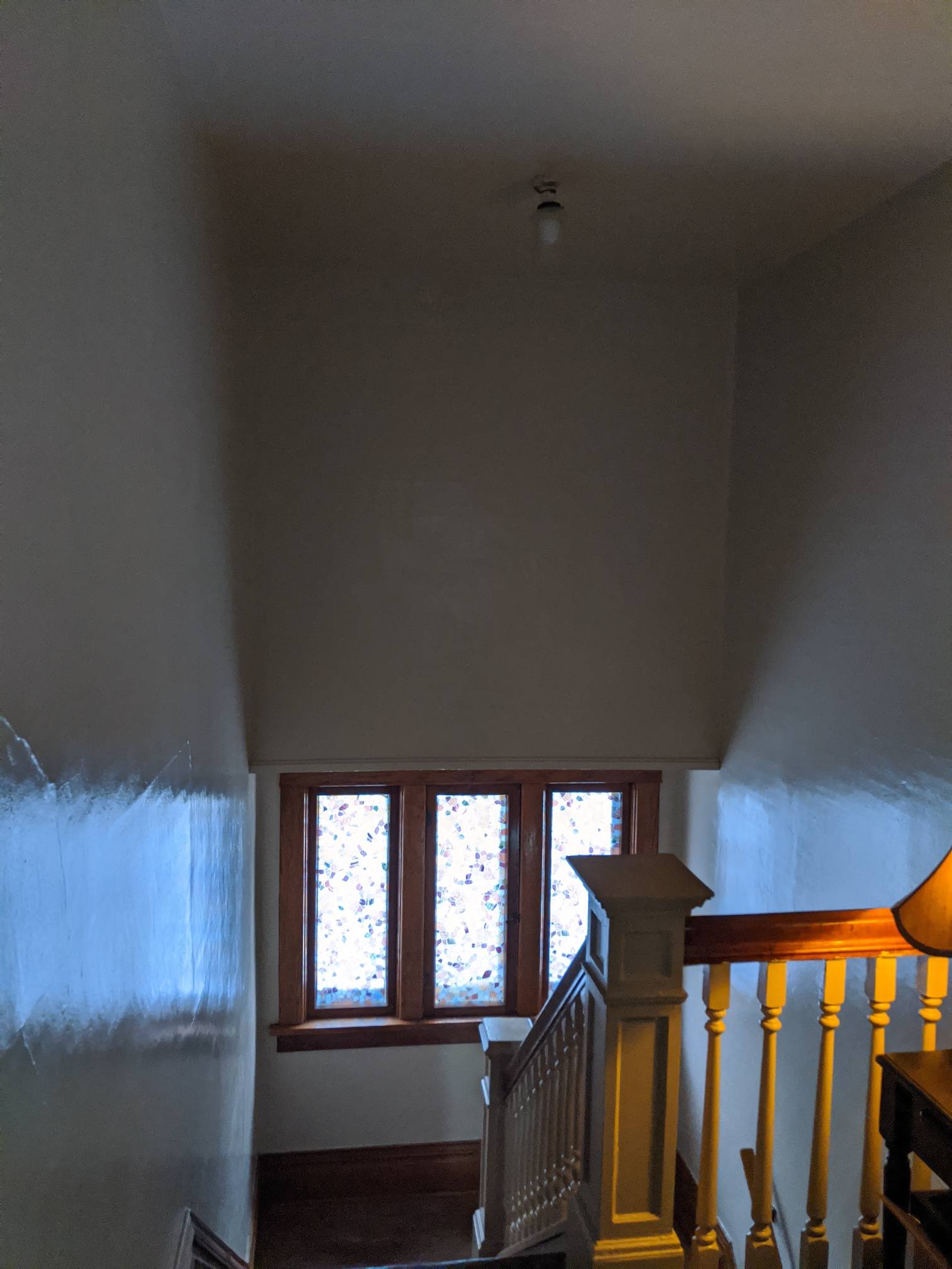 safety How can I safely replace a light fixture above a stairwell