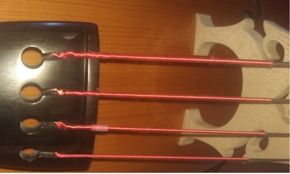 Mysterious plastic tube arriving with double bass strings Music