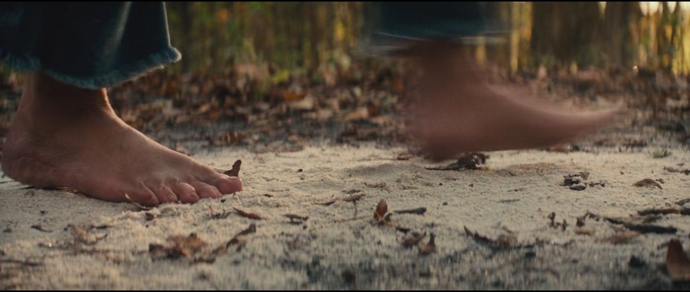 a quiet place Why does the family choose to travel barefoot