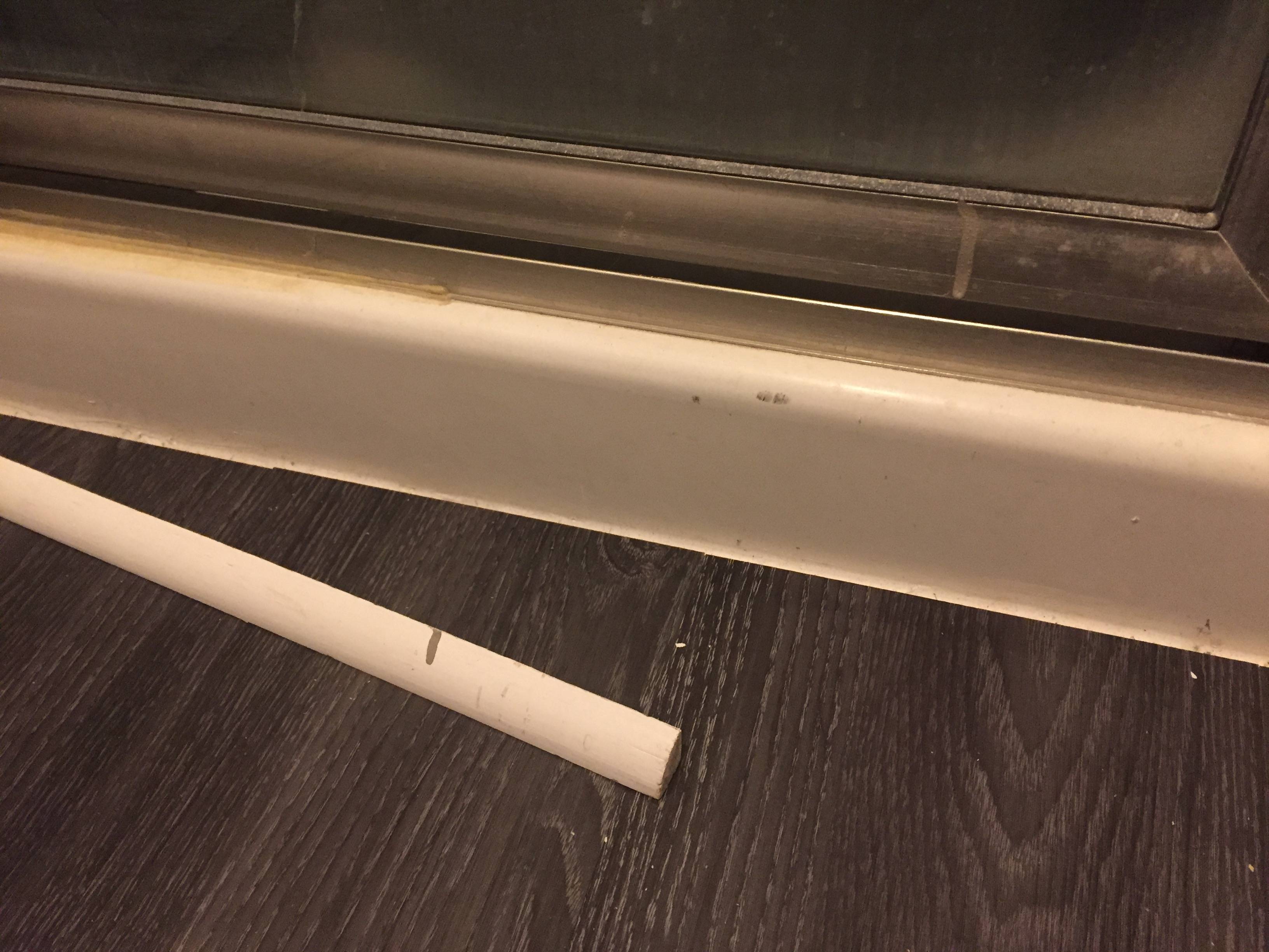 How to attach quarterround molding to the base of a shower stall