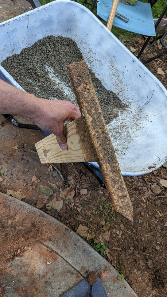 concrete Refilling gravel under slab on a downhill grade Home