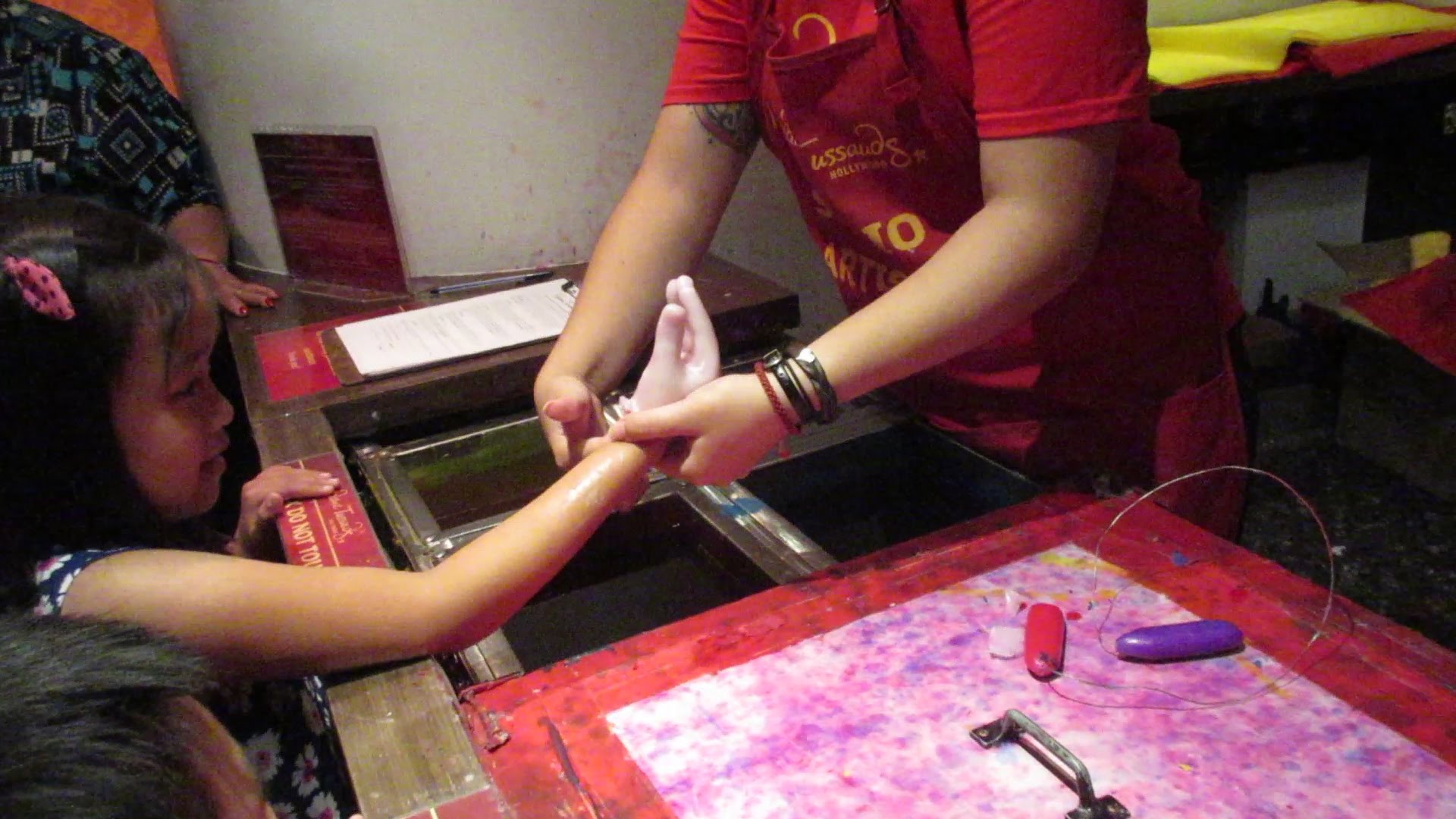 What is Admission + Wax Hand means in Madame Tussaud's Museum in