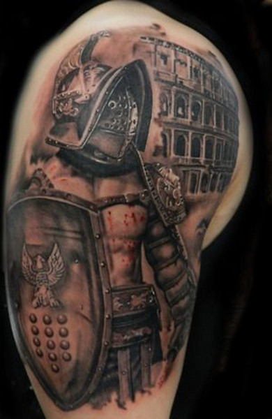 What Does The Gladiator Tattoo Mean? Male Gladiator Tattoo And His Attributes - Helmet, Armor, Shoulder Pad Gladiator Tattoo On The Calf. 600_x_390_jpg