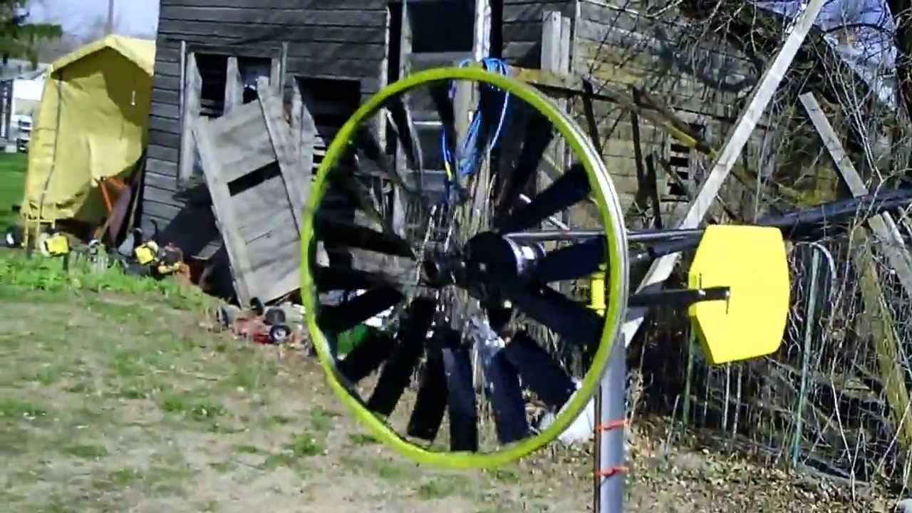 Simple home made wind turbine from bike wheel in the wind YouTube