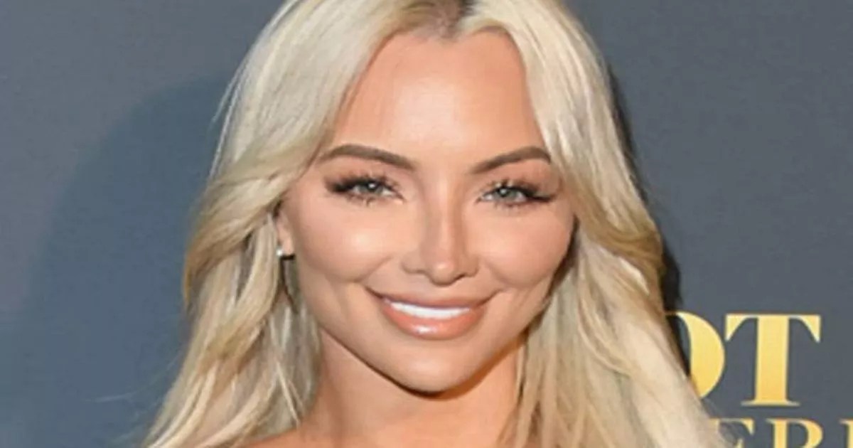 Braless Lindsey Pelas lets it all hang out in daring cutout dress