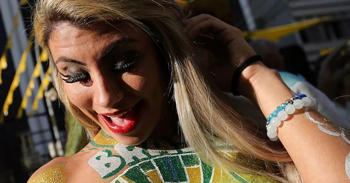 Footie fans STRIP off for body painting at World Cup and Sexy Soccer