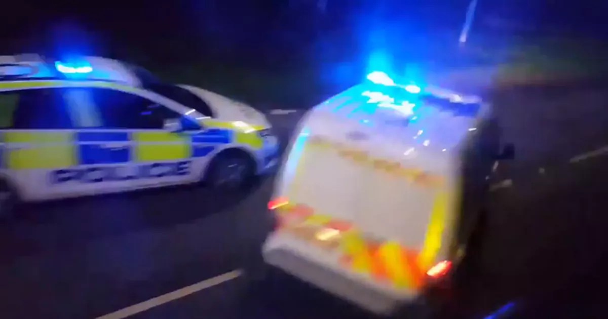 Firefighters cutting trapped person from two car crash at Kelly Bray