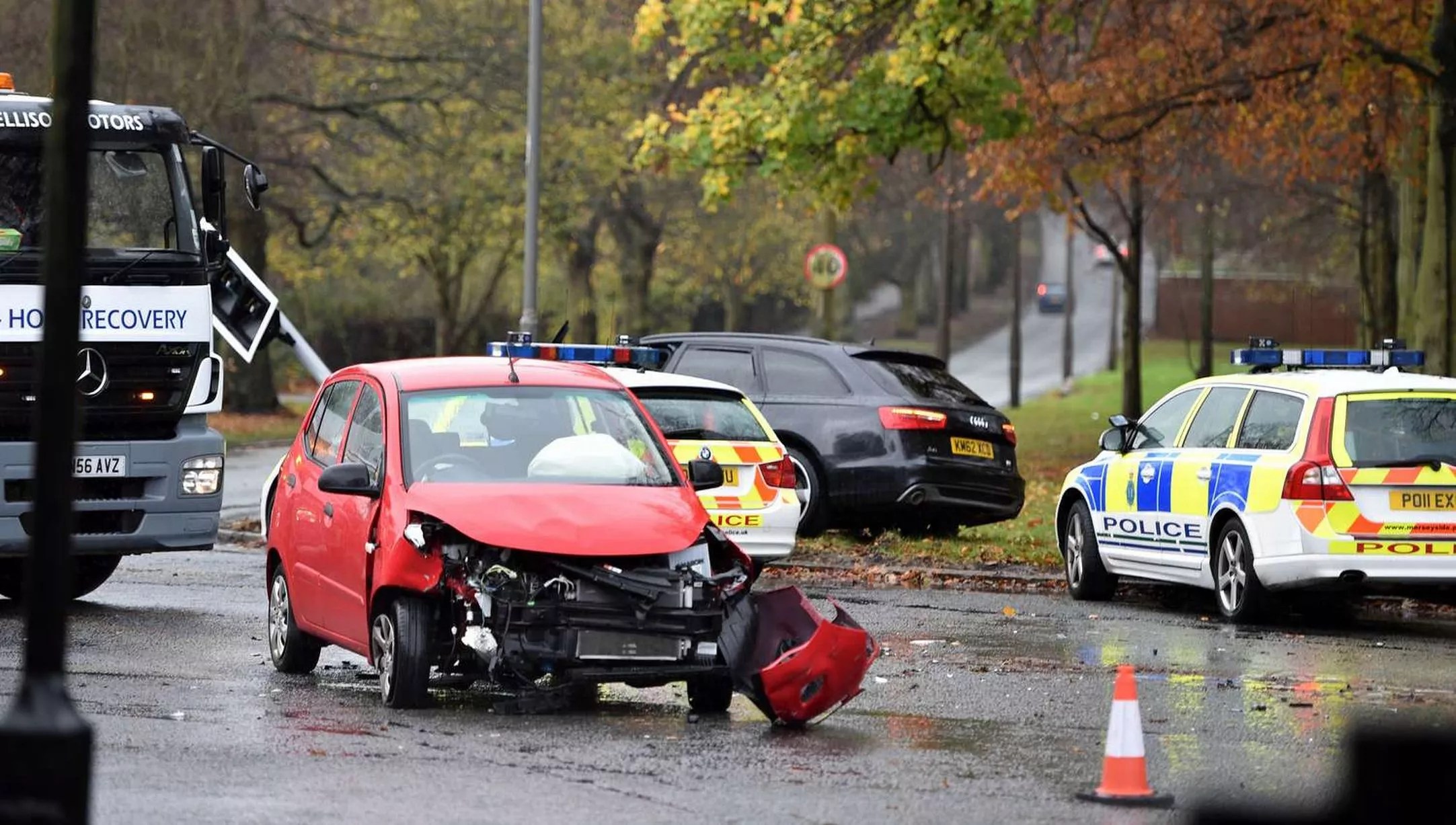 Police at the scene of an RTC involving an black Audi and a red