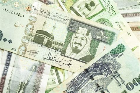80 ألف ريال كم دولار - 7 ريال سعودي = 1