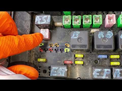 Where are the windshield wiper relays located in the Dodge Grand