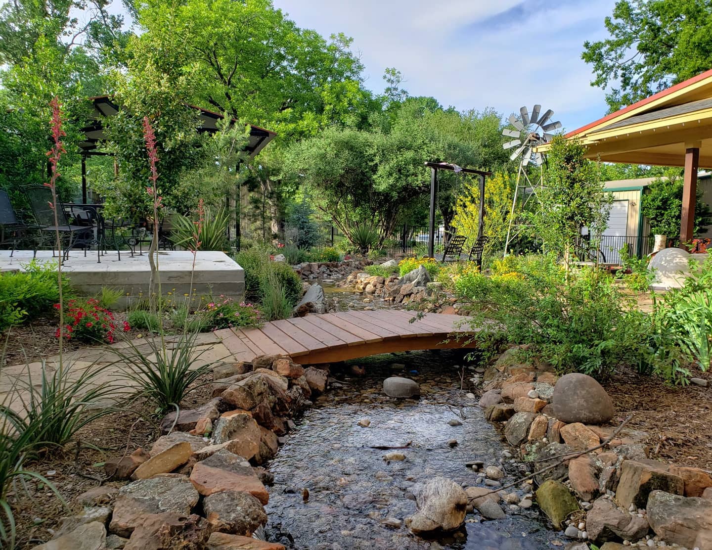 Stream with bridge Ideal Landscape Services