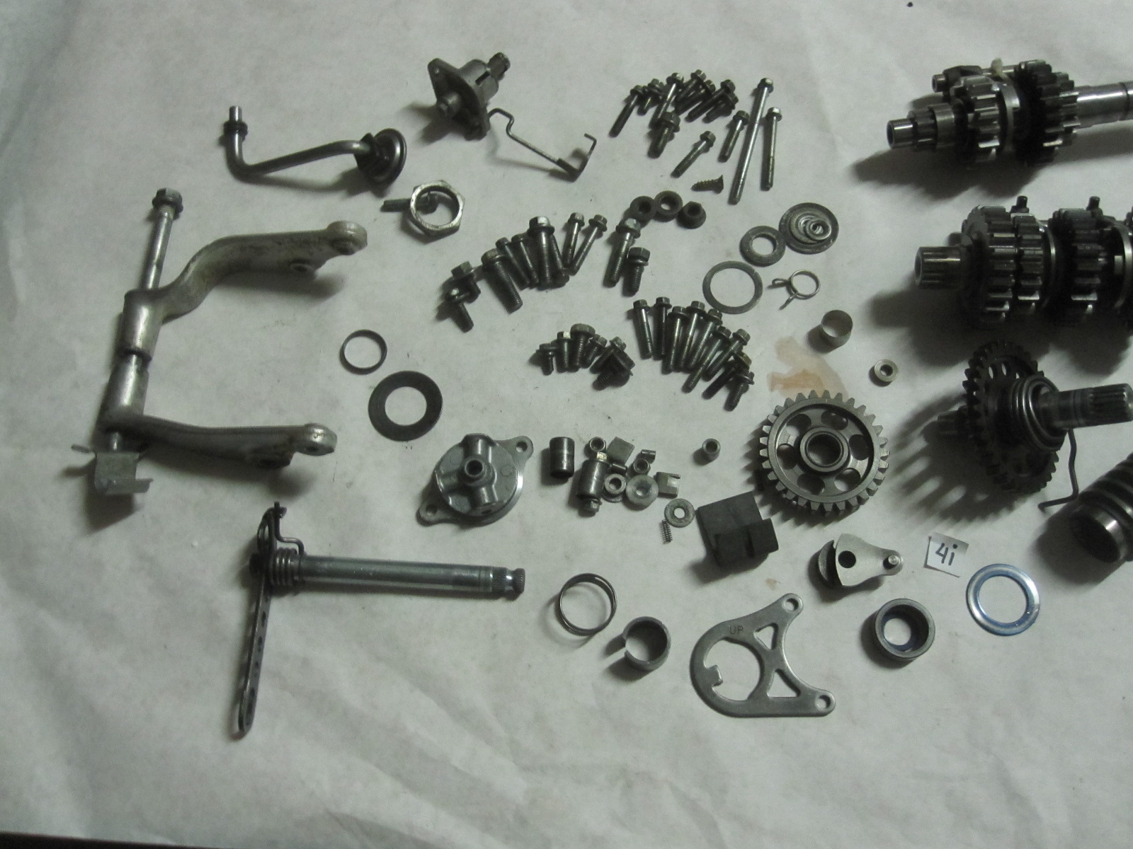 These are various parts for a 20042006 Honda CFR450R dirt bike. The