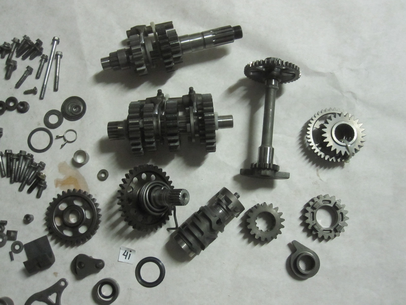 These are various parts for a 20042006 Honda CFR450R dirt bike. The