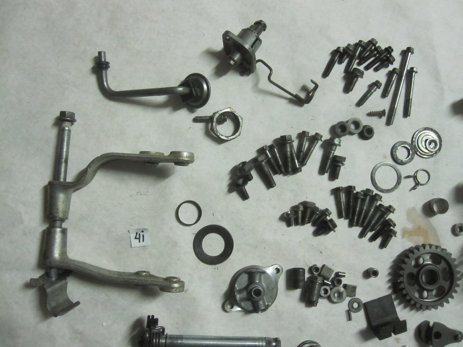 These are various parts for a 20042006 Honda CFR450R dirt bike. The