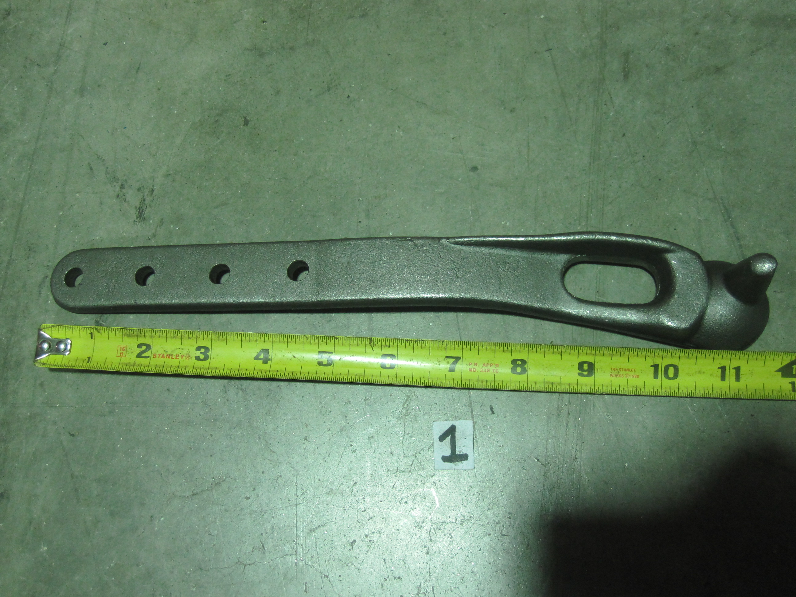 This is one half of a Pitman arm clamp for a farm tractor sickle bar