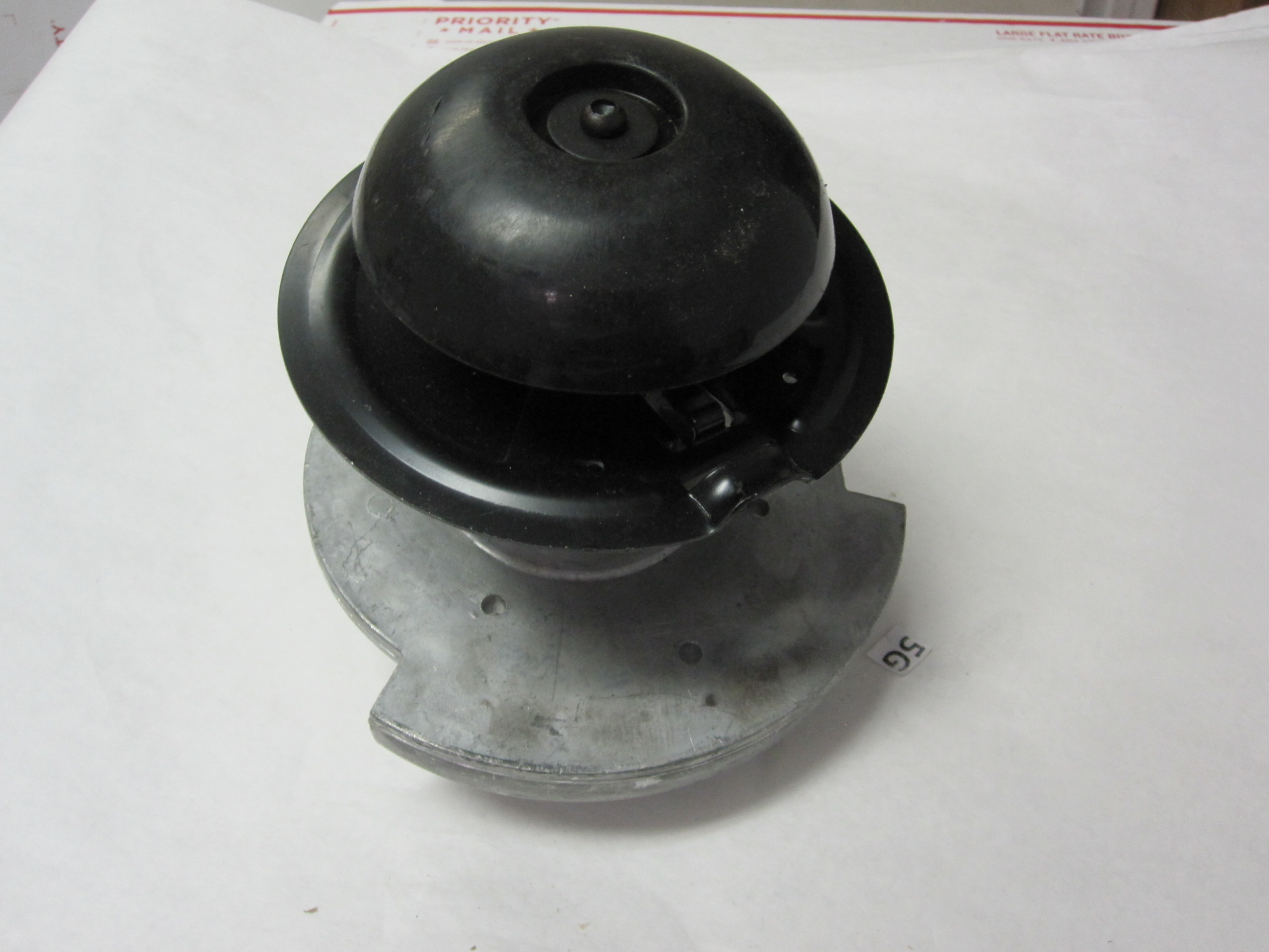 This is a string trimmer head/spindle for a walkbehind trimmer for
