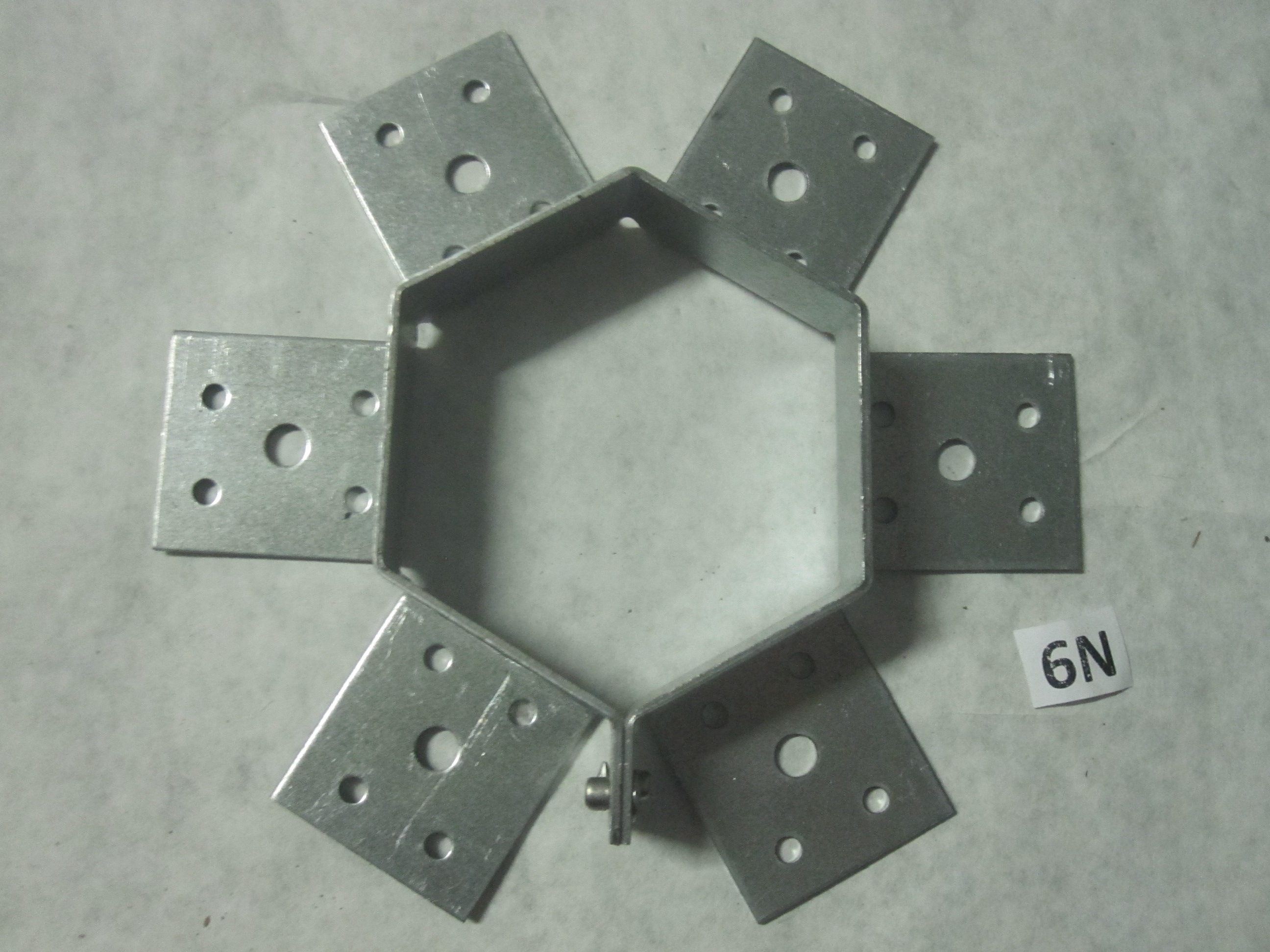 I agree it is a Galvanized Gazebo Rafter Tie. Center bracket is just