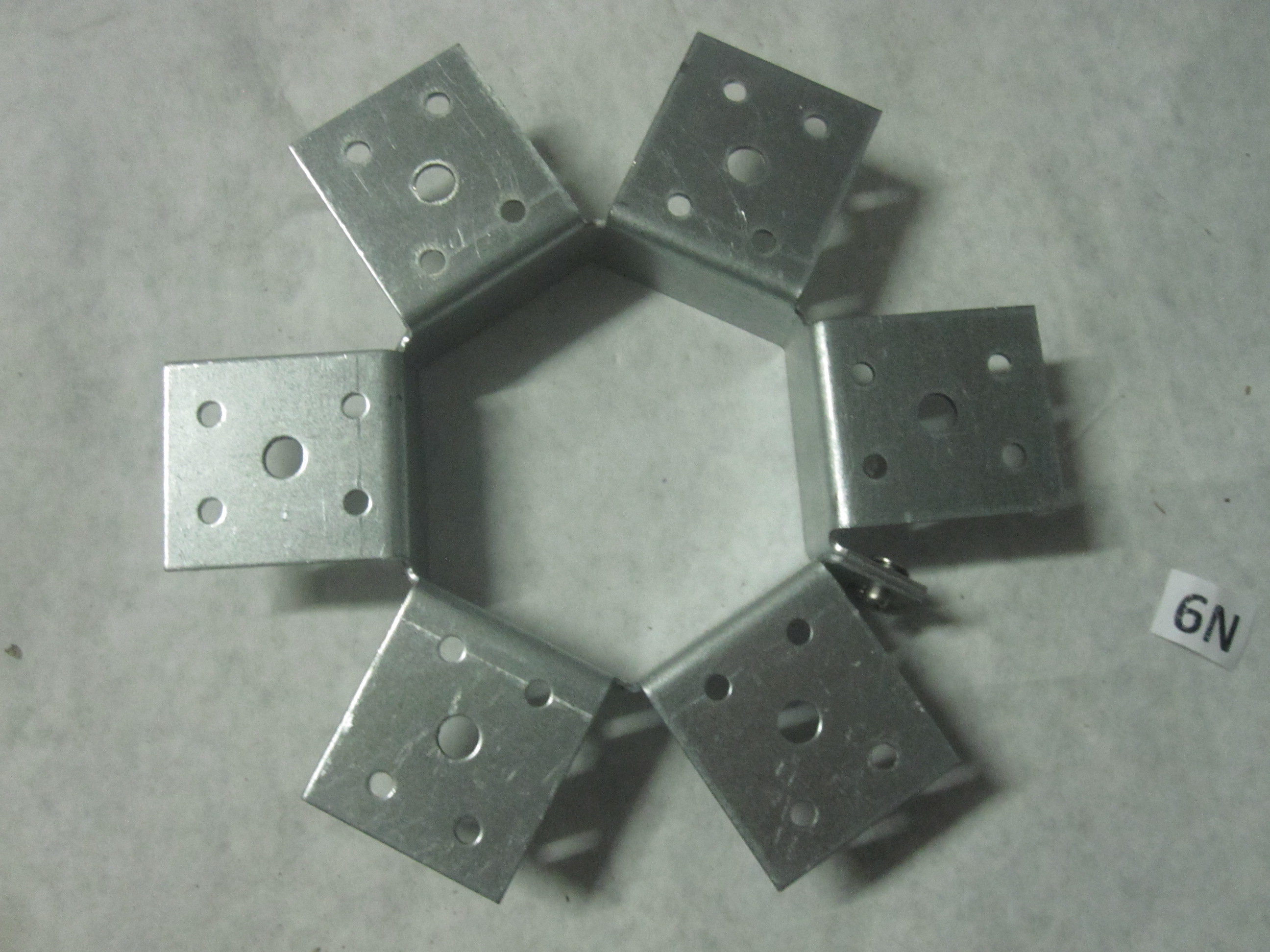 I agree it is a Galvanized Gazebo Rafter Tie. Center bracket is just