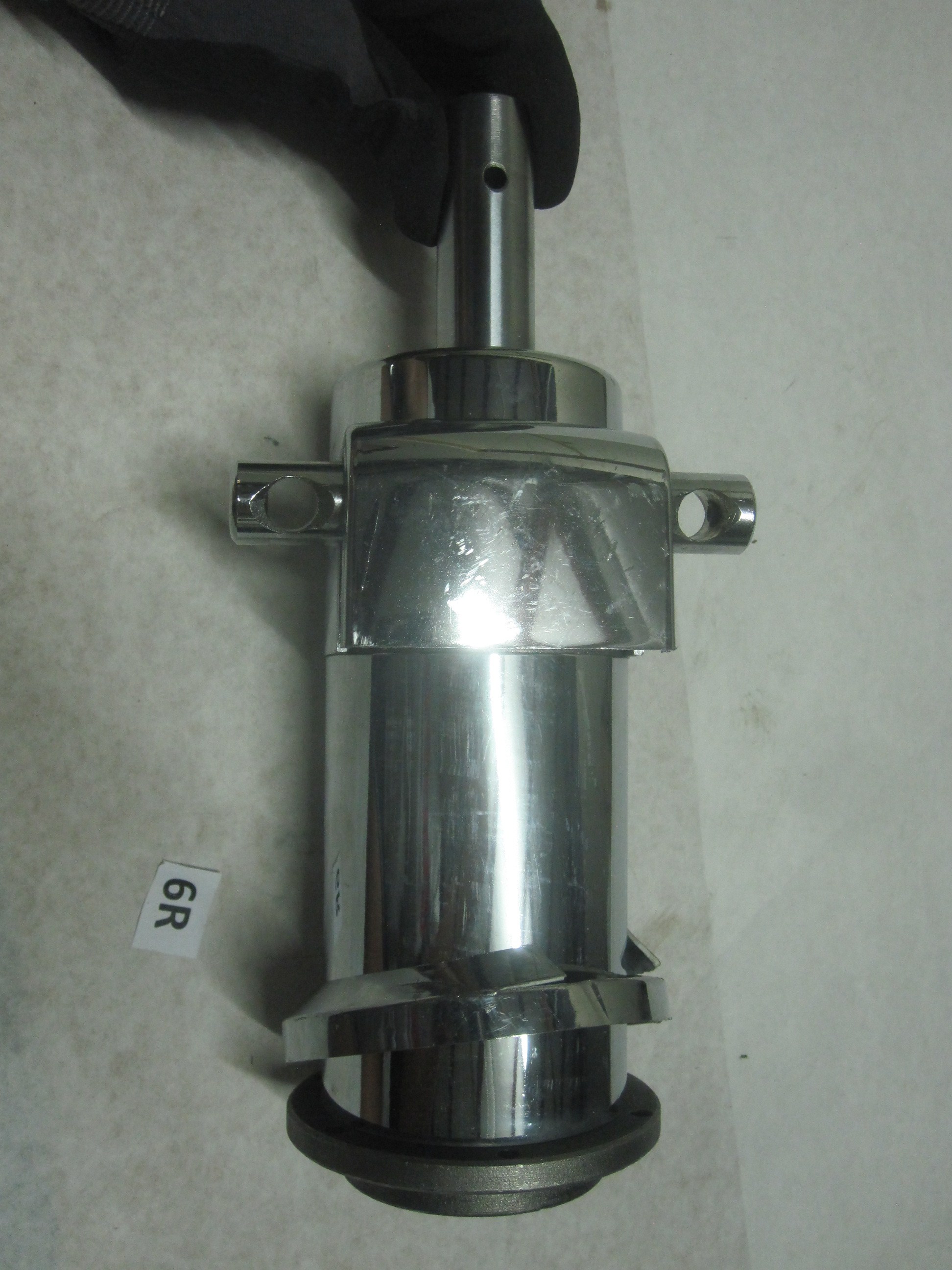 It's a hydraulic pump and cylinder for a salon/barber chair. It can fit