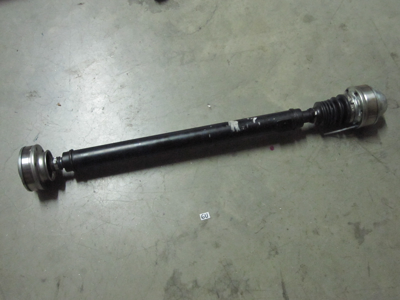 This is a front drive shaft (prop shaft) for a Jeep Grand Cherokee