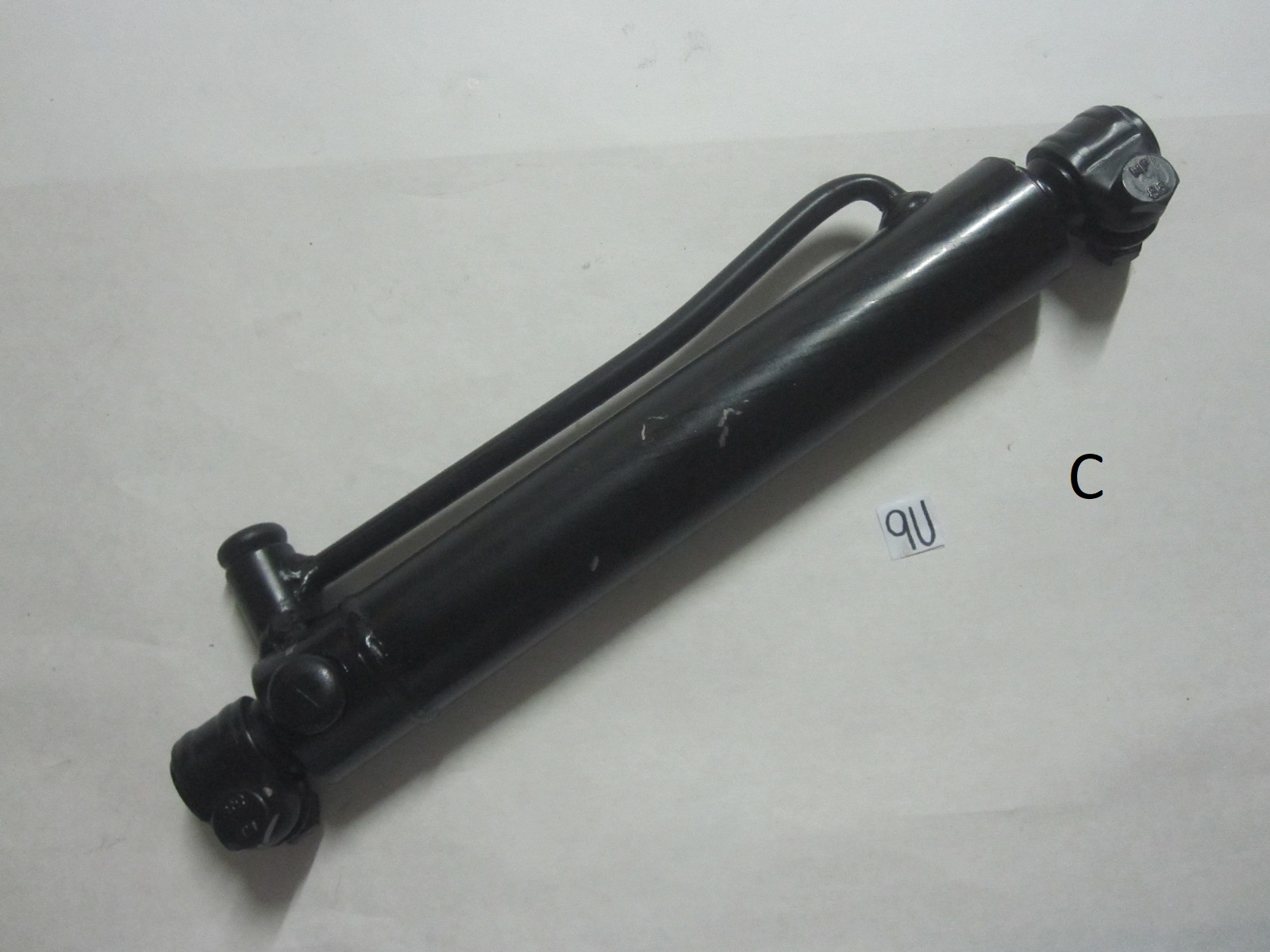 This is a power steering cylinder for a Case 2wd tractor. It fits